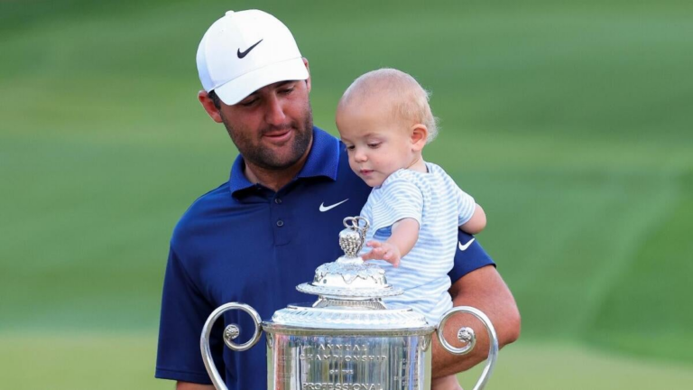 WATCH: Scottie Scheffler went straight to dad duty while signing scorecard after PGA Championship win