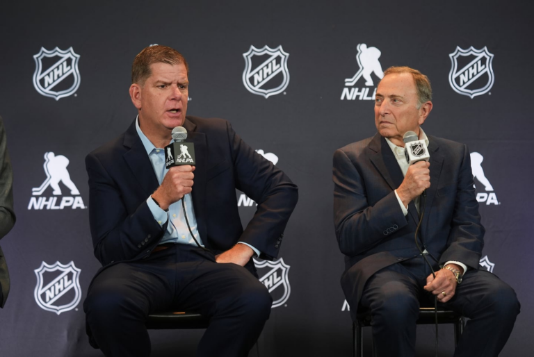 NHL to implement a playoff salary cap this season, AP source says