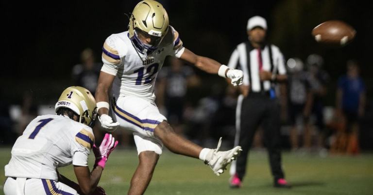 Corde Gage uses hands and feet to help CBC roll by SLUH for MCC championsihp