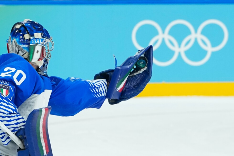 Lighter-colored boards replace dark ones in the hockey arenas at the Olympics