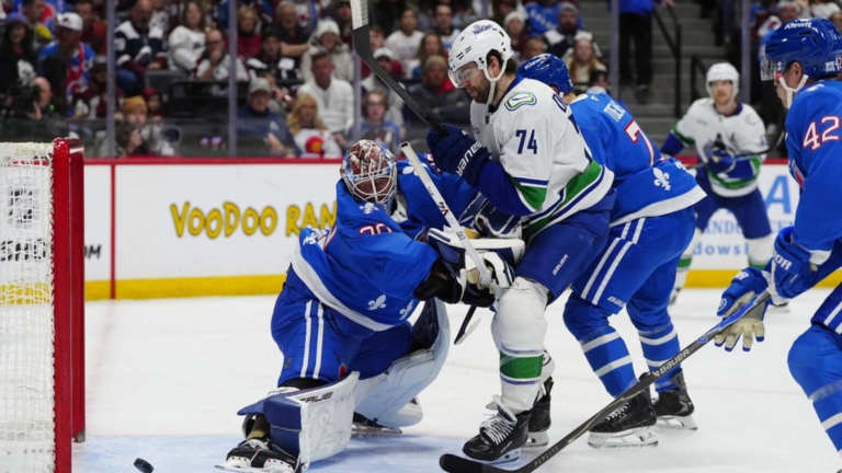 NHL-worst Canucks stun league-best Avalanche 8-6