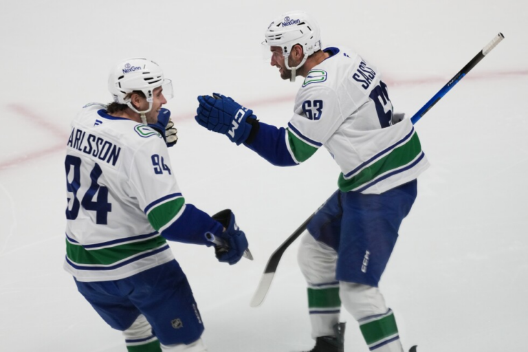 Boeser has hat trick, last-place Canucks overcomes blowing 4-goal lead to beat NHL-leading Avs 8-6