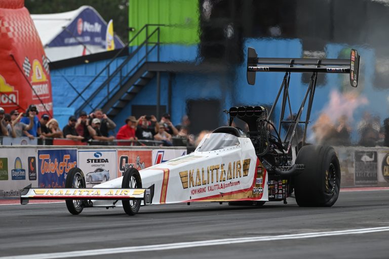 Shawn Langdon breaks the NHRA speed record by reaching 345 mph in his Top Fuel dragster